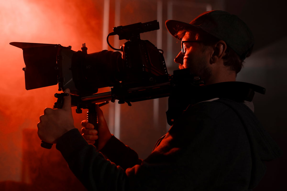 Videographer holding a video camera