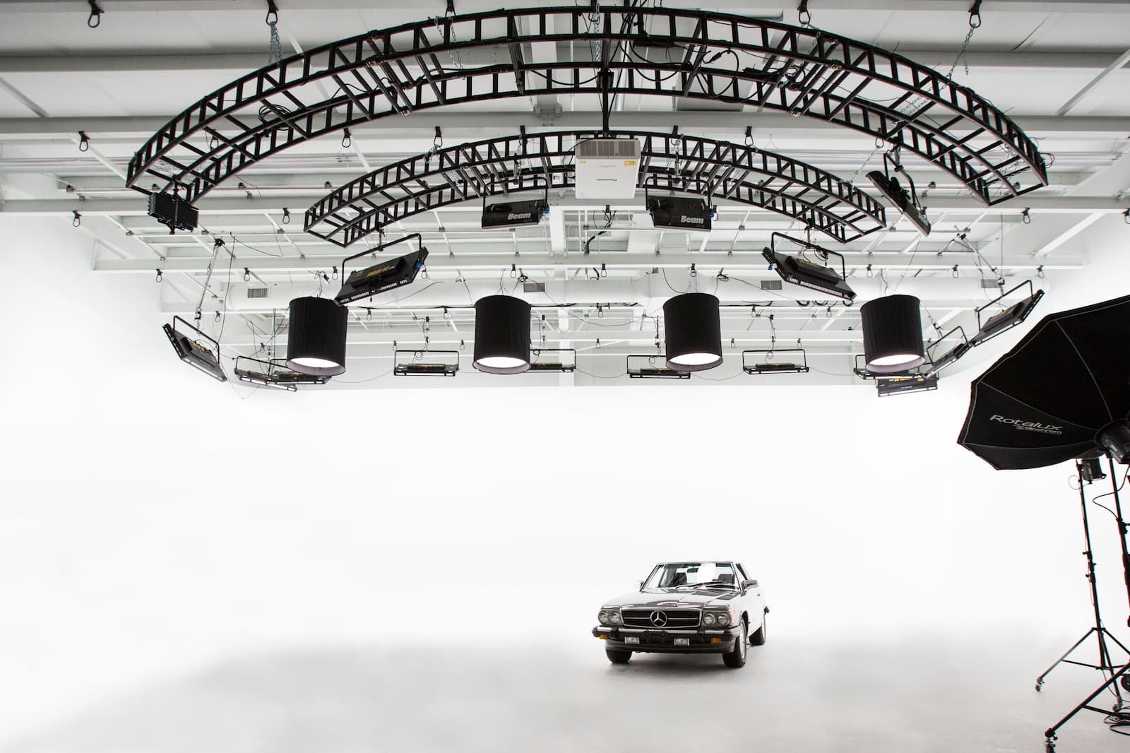 Photo of a silver-colored vintage Mercedes-Benz inside our cinema stage