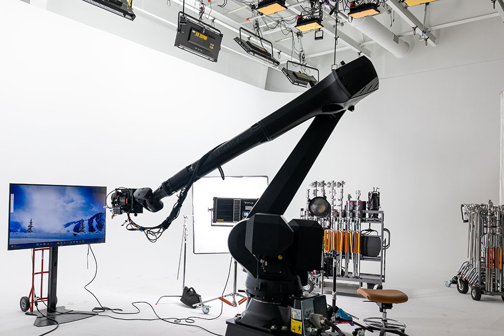 Colossus camera robot on a white stage with equipment